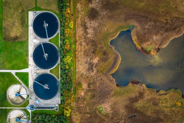 Sewage Treatment Plant near a nature reserve and the ocean in Denmark. Environmental conservation and preservation of clean waters resources is high priority and the Scandinavian countries are at the forefront in development of sustainable solutions for waste water treatment to secure a clean earth for future generations. Besides the waste products are recycled for energy production as green biofuel ultimately leading to decreased CO2 emission, global warming and climate change.